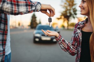 Driving teacher gives the keys to female student